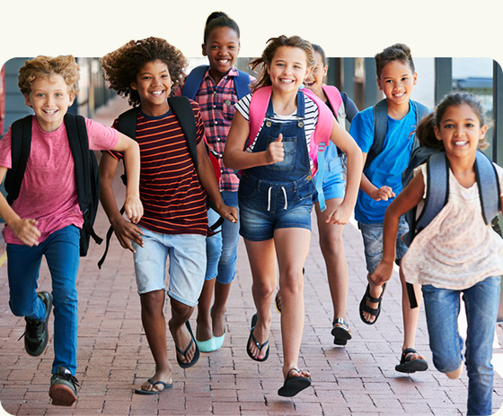 young kids running and smiling