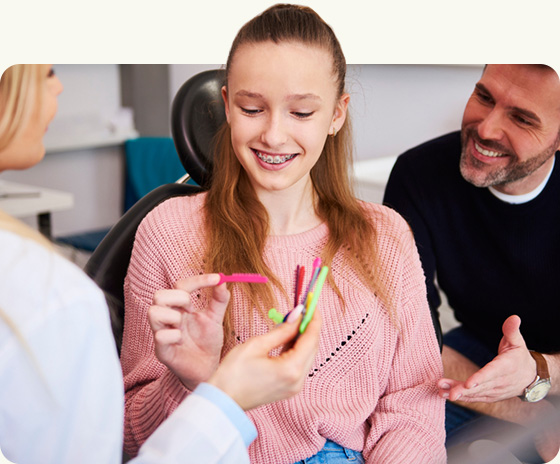 teenage girl choosing braces color