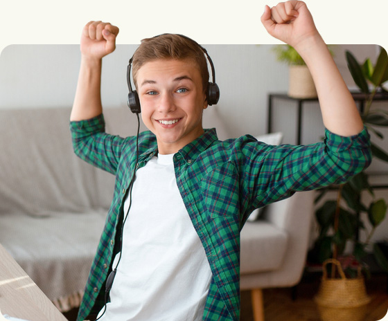 Smiling boy listing to music